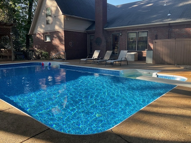 pool with a patio area