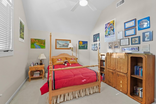 carpeted bedroom with visible vents, vaulted ceiling, baseboards, and ceiling fan