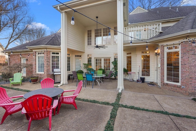 view of patio / terrace featuring ceiling fan, outdoor dining space, and a balcony