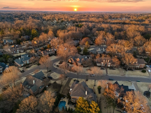 birds eye view of property featuring a wooded view