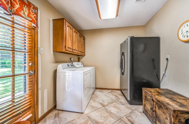 laundry room with washer and dryer, cabinet space, visible vents, and baseboards