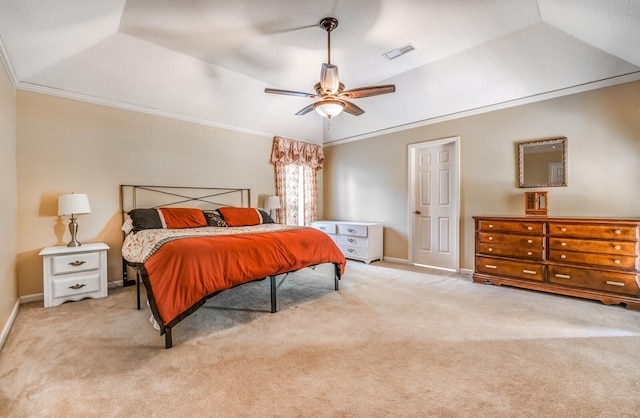 carpeted bedroom with visible vents, a raised ceiling, and ornamental molding