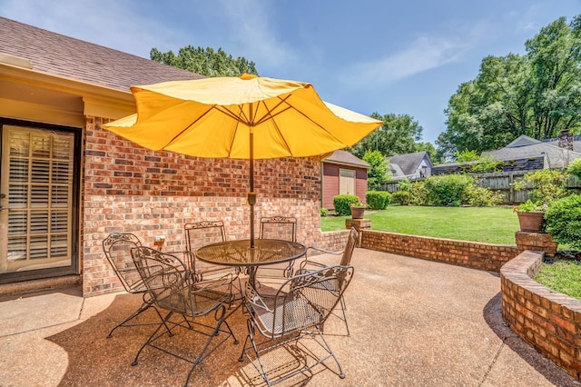 view of patio / terrace featuring outdoor dining space and fence