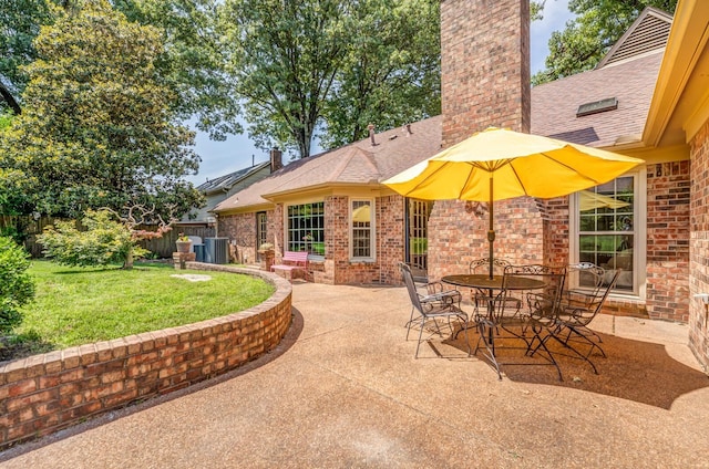 view of patio with cooling unit and fence