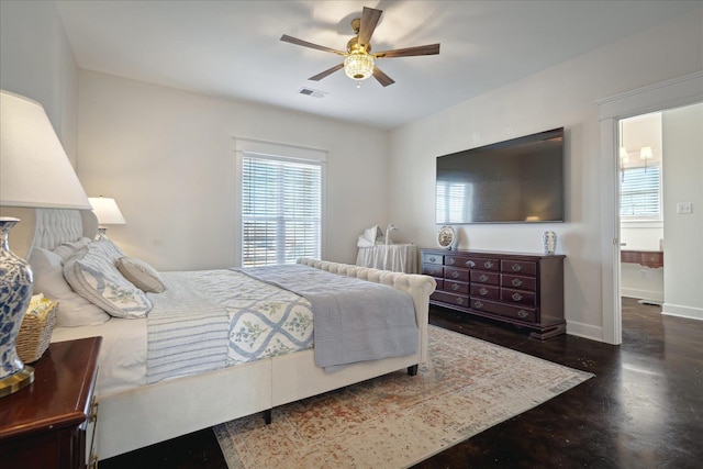 bedroom featuring baseboards, visible vents, and a ceiling fan