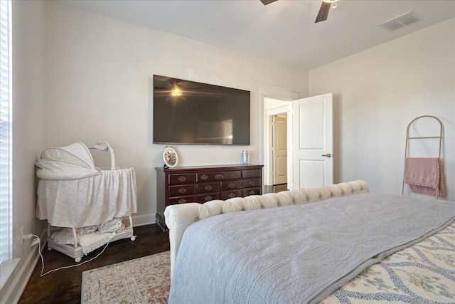 bedroom featuring a ceiling fan, visible vents, and baseboards