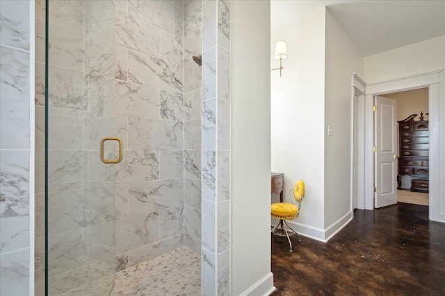 full bath featuring a stall shower, finished concrete floors, and baseboards