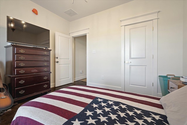 bedroom with visible vents and baseboards