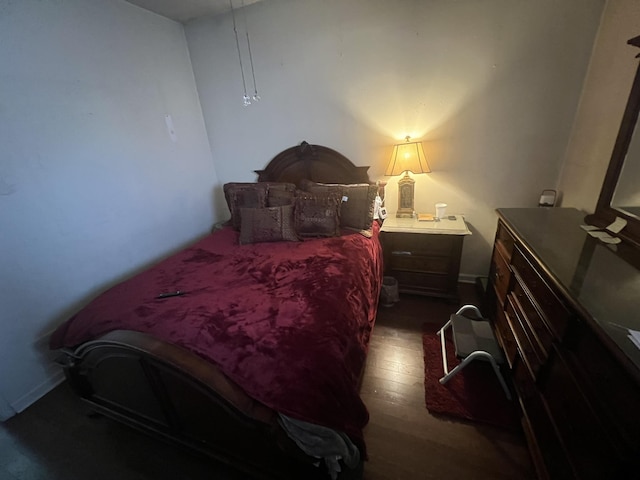 bedroom featuring dark wood-type flooring