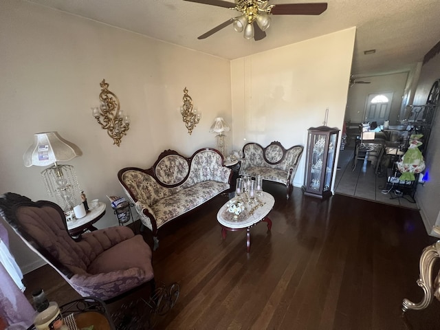 living area featuring ceiling fan and wood finished floors