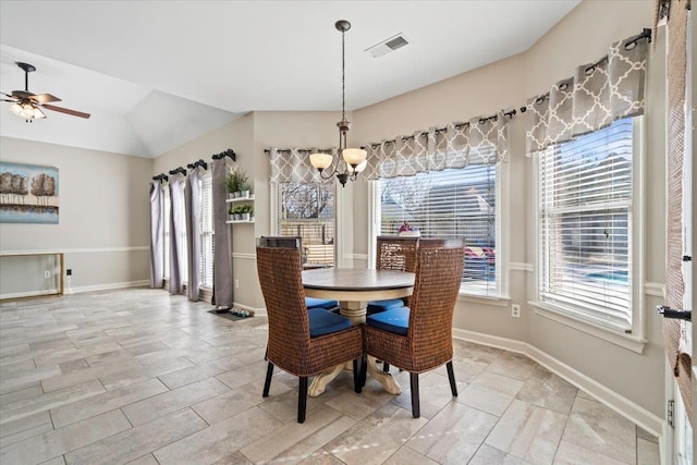 dining space featuring a wealth of natural light, visible vents, baseboards, and ceiling fan with notable chandelier