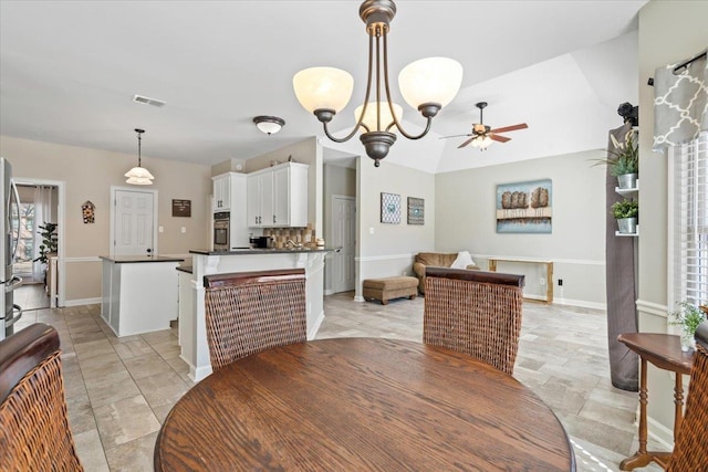 dining area featuring visible vents, baseboards, and ceiling fan with notable chandelier