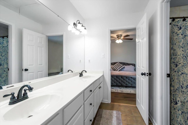 ensuite bathroom with a sink, ensuite bath, and double vanity