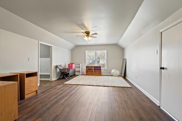 bonus room with lofted ceiling, ceiling fan, baseboards, and dark wood-type flooring