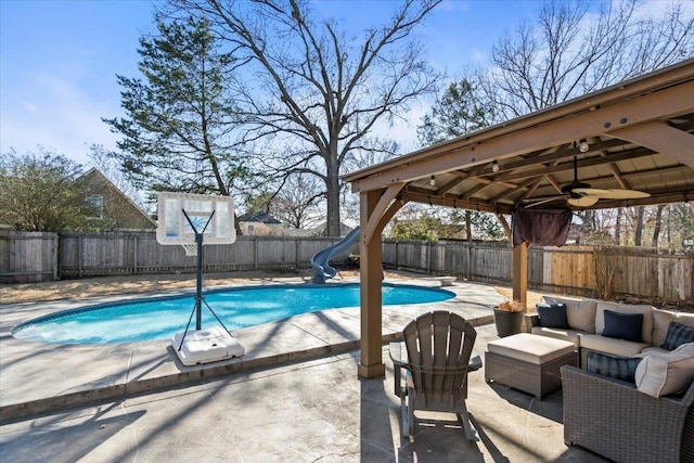 view of swimming pool with a water slide, a fenced backyard, a gazebo, a fenced in pool, and a patio area