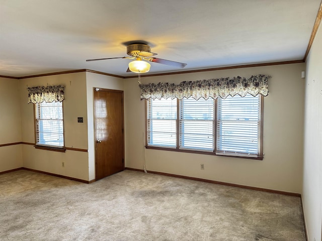 empty room with a healthy amount of sunlight, baseboards, and light colored carpet