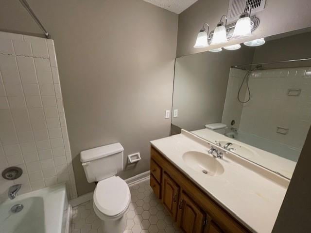 full bathroom with toilet, vanity, baseboards, tub / shower combination, and tile patterned floors