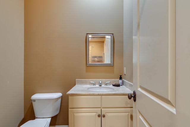 half bath with vanity and toilet