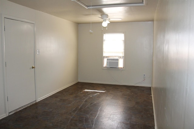 spare room with attic access and baseboards