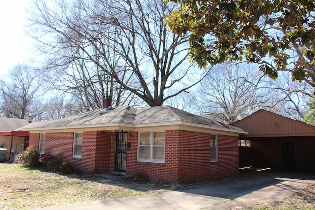 view of front of house featuring brick siding