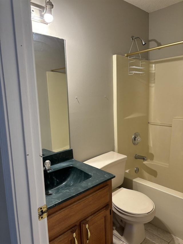 full bathroom featuring a textured ceiling, toilet, shower / bath combination, vanity, and tile patterned floors