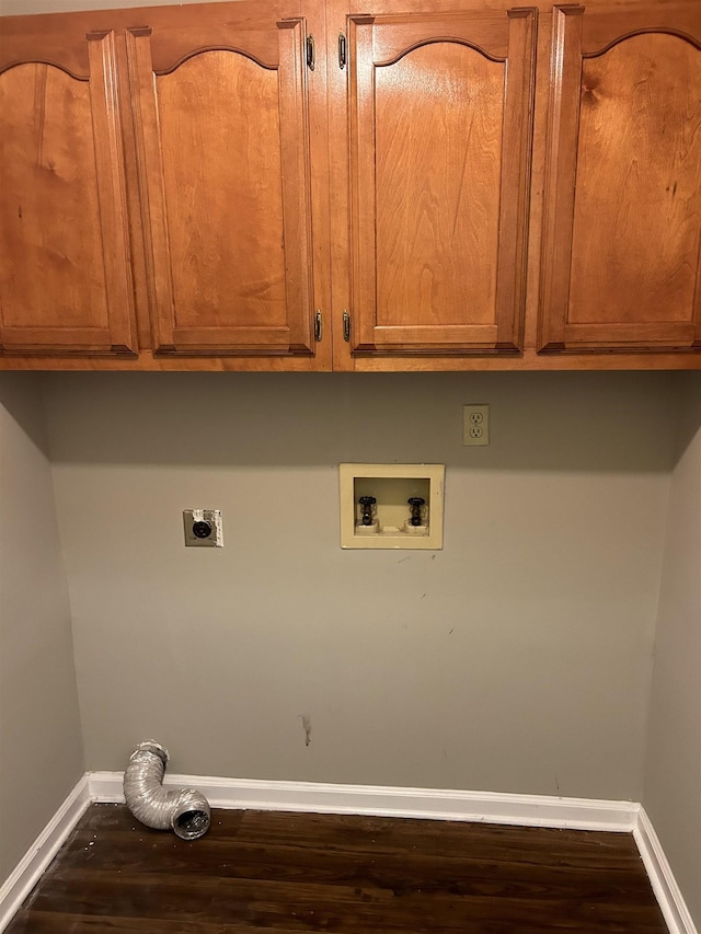 clothes washing area with cabinet space, baseboards, wood finished floors, hookup for a washing machine, and hookup for an electric dryer