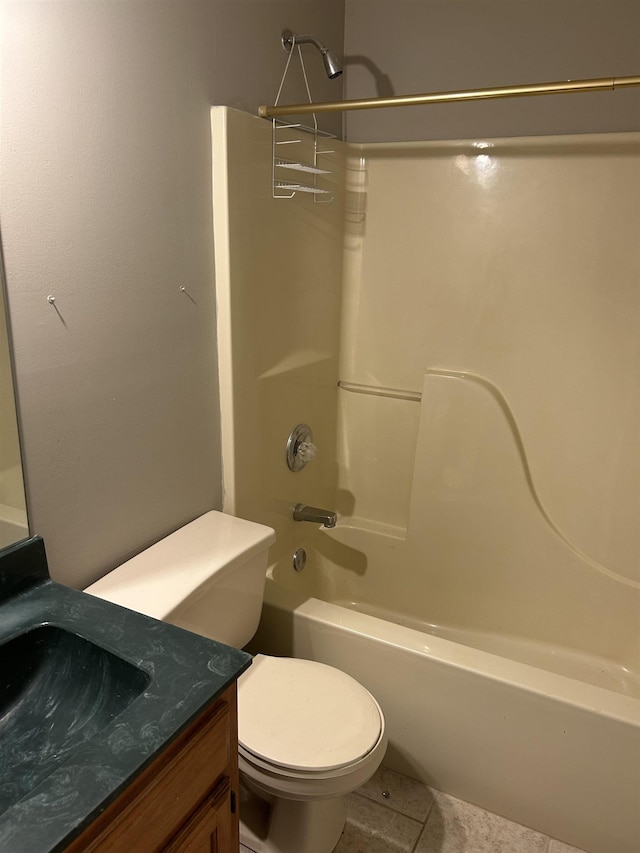 full bath featuring shower / bath combination, tile patterned flooring, vanity, and toilet