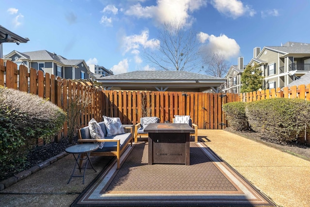 view of patio / terrace featuring a residential view, fence, and outdoor lounge area