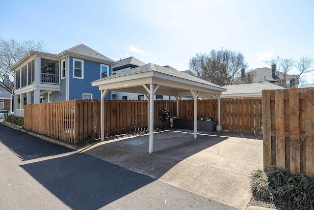 view of parking with fence