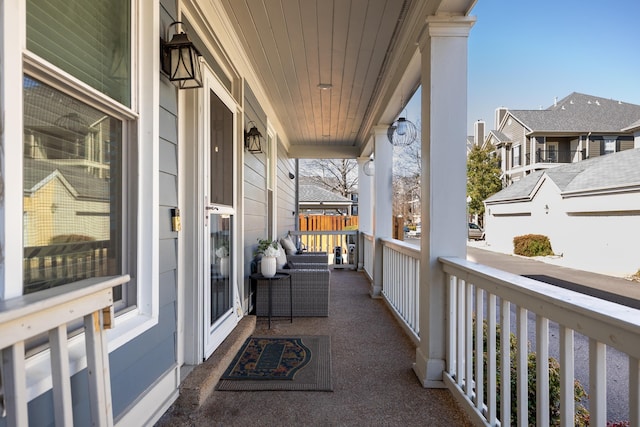 balcony with a residential view and a porch