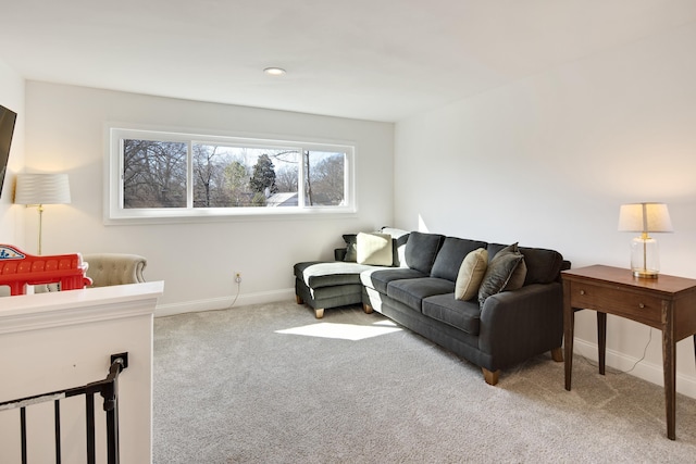 living room featuring carpet floors and baseboards