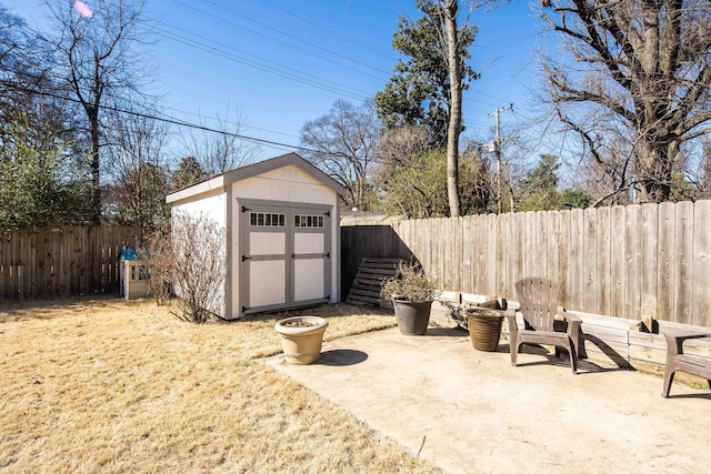 view of shed featuring a fenced backyard