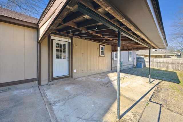 view of patio / terrace with fence and cooling unit