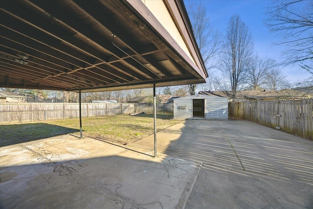 view of patio / terrace with a fenced backyard and an outdoor structure