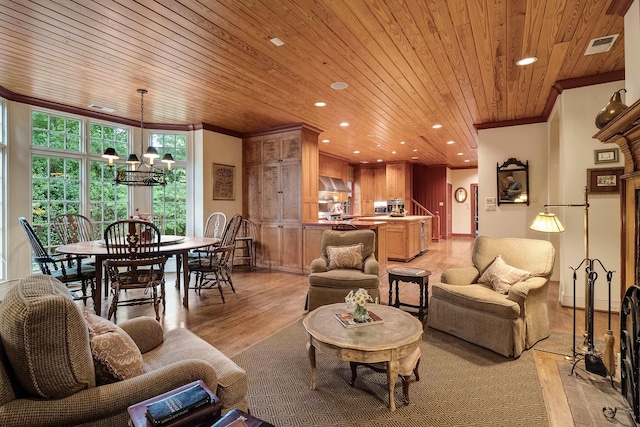 living area featuring recessed lighting, visible vents, ornamental molding, light wood-style floors, and wood ceiling