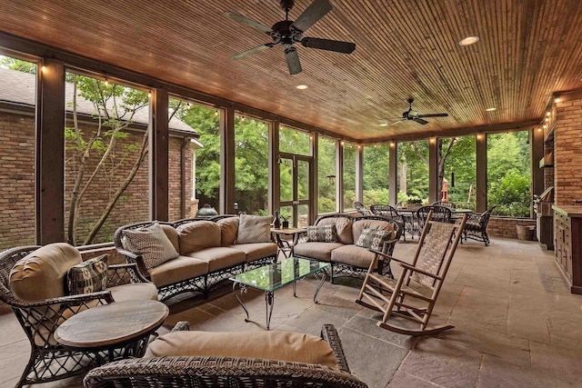 sunroom / solarium with wooden ceiling and a ceiling fan