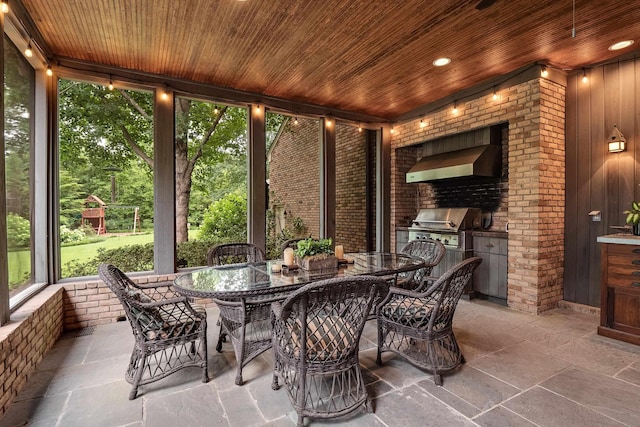 sunroom featuring wooden ceiling