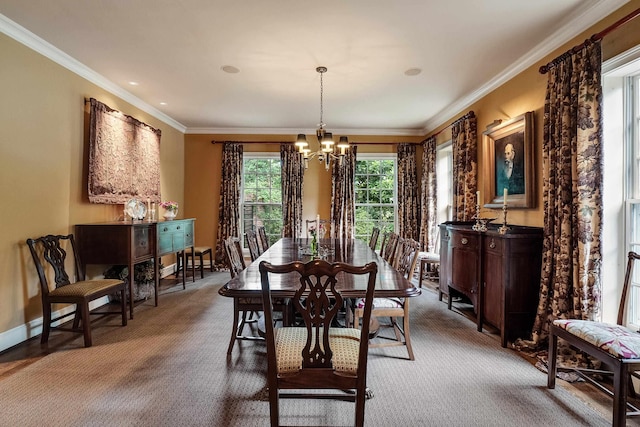 dining space featuring baseboards, ornamental molding, carpet flooring, and an inviting chandelier