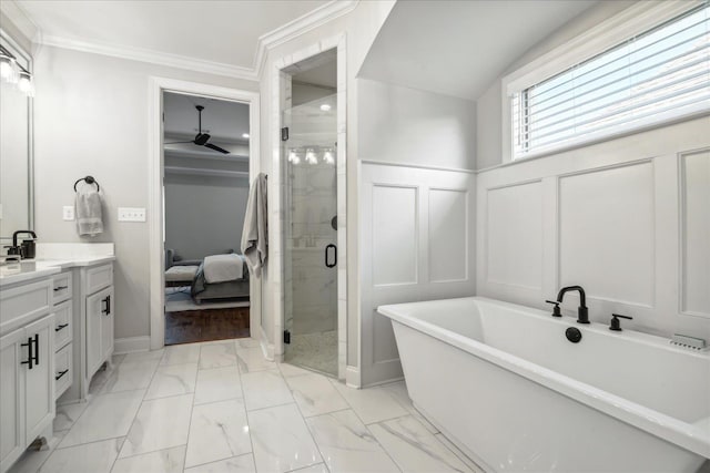 bathroom featuring a decorative wall, vanity, marble finish floor, ornamental molding, and a shower stall