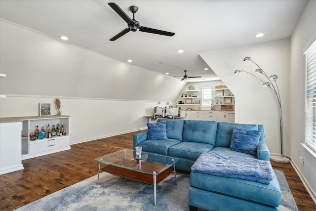 living room with baseboards, vaulted ceiling, wood finished floors, and recessed lighting