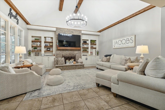 living area with high vaulted ceiling, built in features, beam ceiling, and a stone fireplace