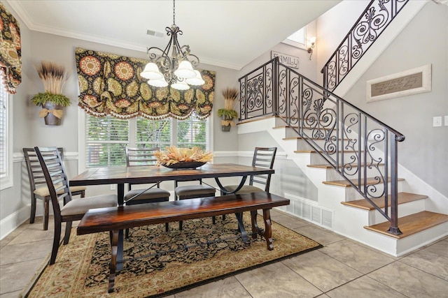 dining area featuring a chandelier, ornamental molding, stairs, and visible vents