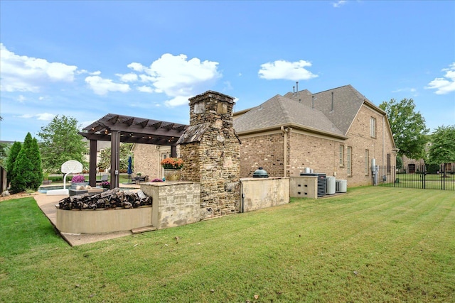 exterior space featuring brick siding, a lawn, fence, and a pergola