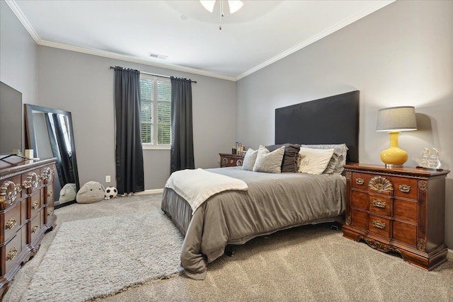 bedroom with ornamental molding, light carpet, visible vents, and baseboards