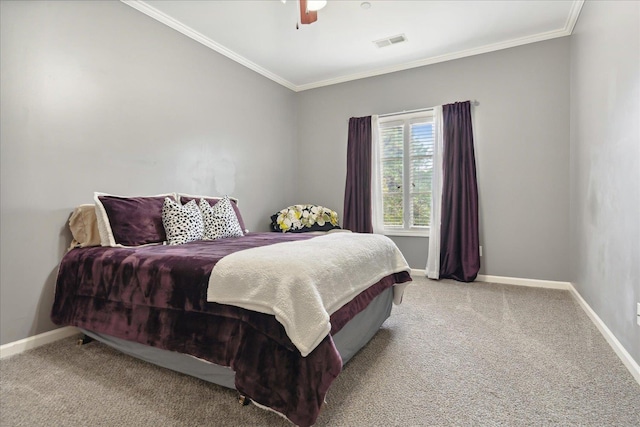 carpeted bedroom featuring crown molding, a ceiling fan, visible vents, and baseboards