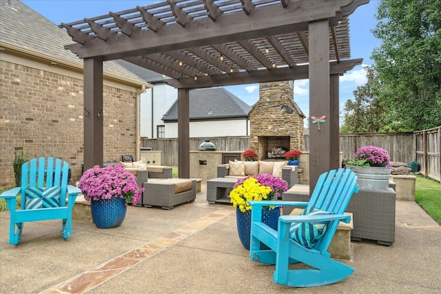 view of patio with a fenced backyard, an outdoor living space with a fireplace, and a pergola