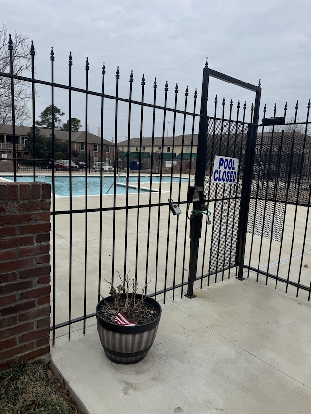 exterior space featuring a gate and fence