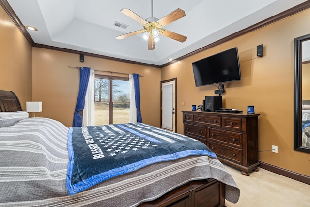 bedroom with light carpet, visible vents, baseboards, ornamental molding, and a raised ceiling