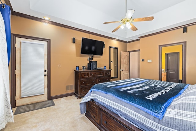 bedroom with a raised ceiling, visible vents, ornamental molding, light carpet, and baseboards