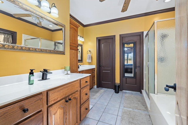 bathroom with a ceiling fan, a stall shower, crown molding, and tile patterned floors